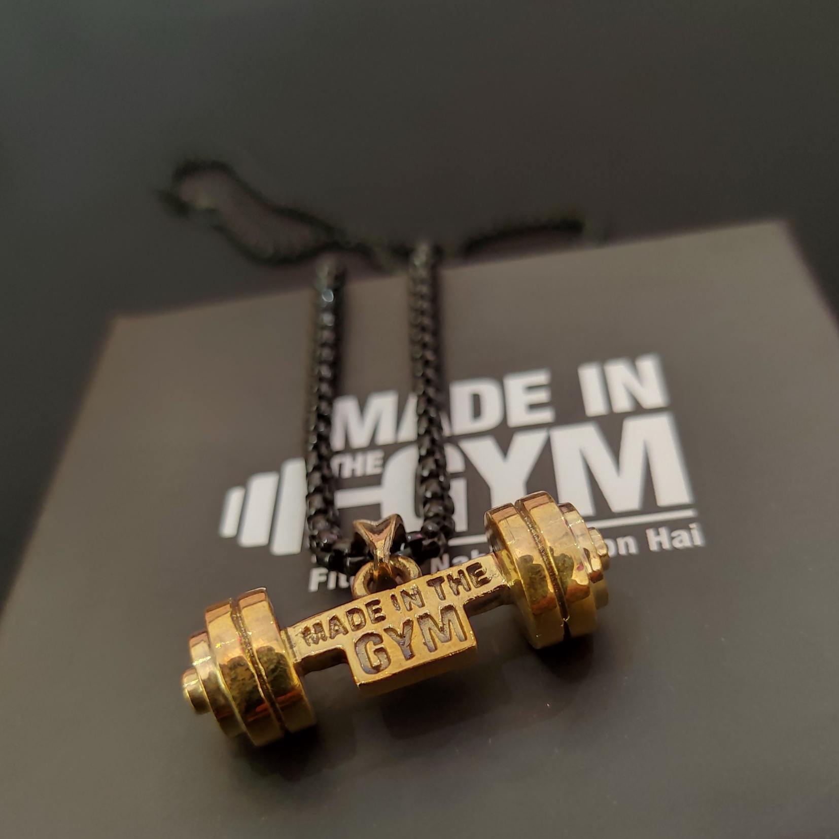 Made in the GYM pendant with branded packaging and card – premium unboxing experience for fitness lovers.