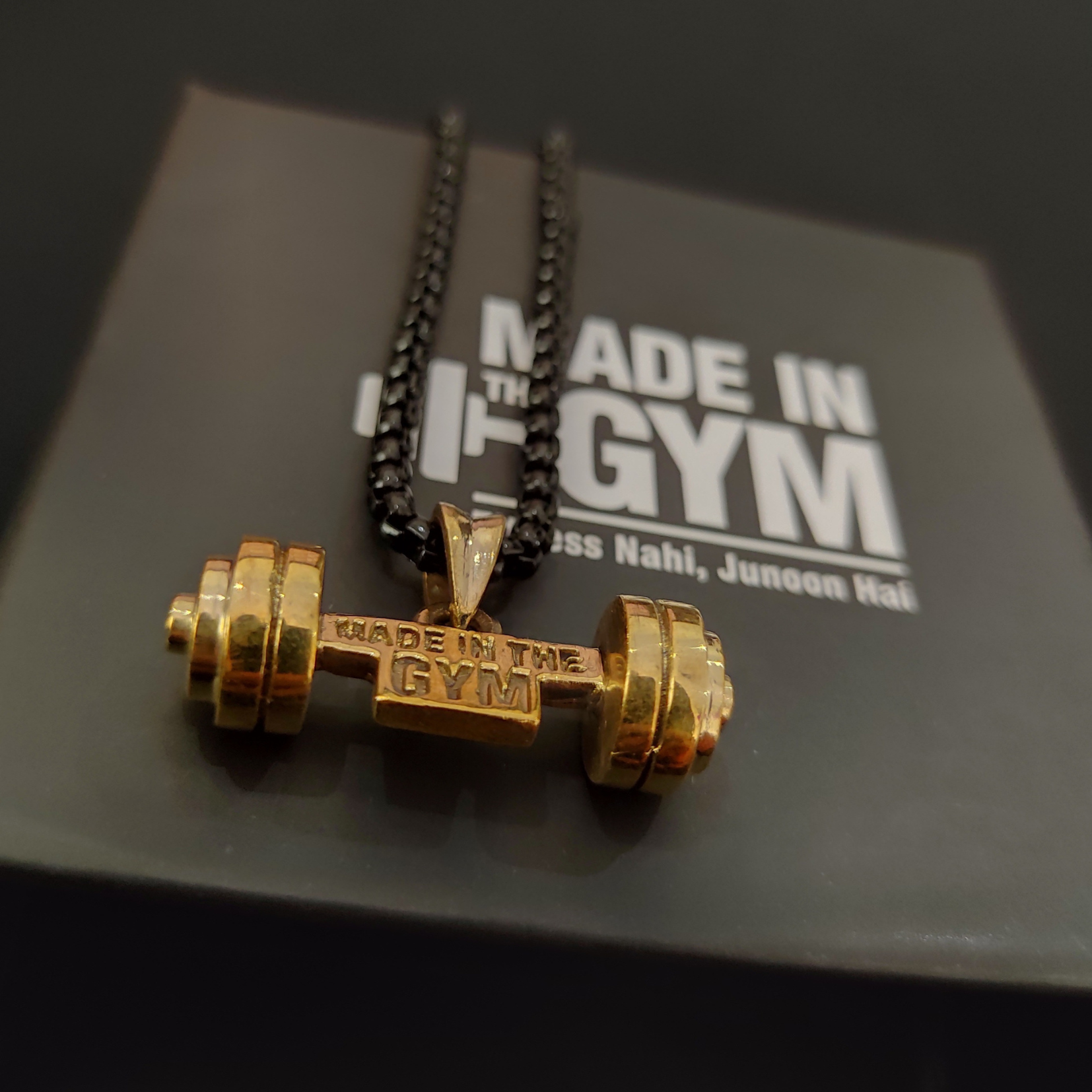 Made in the GYM pendant with branded packaging and card – premium unboxing experience for fitness lovers.