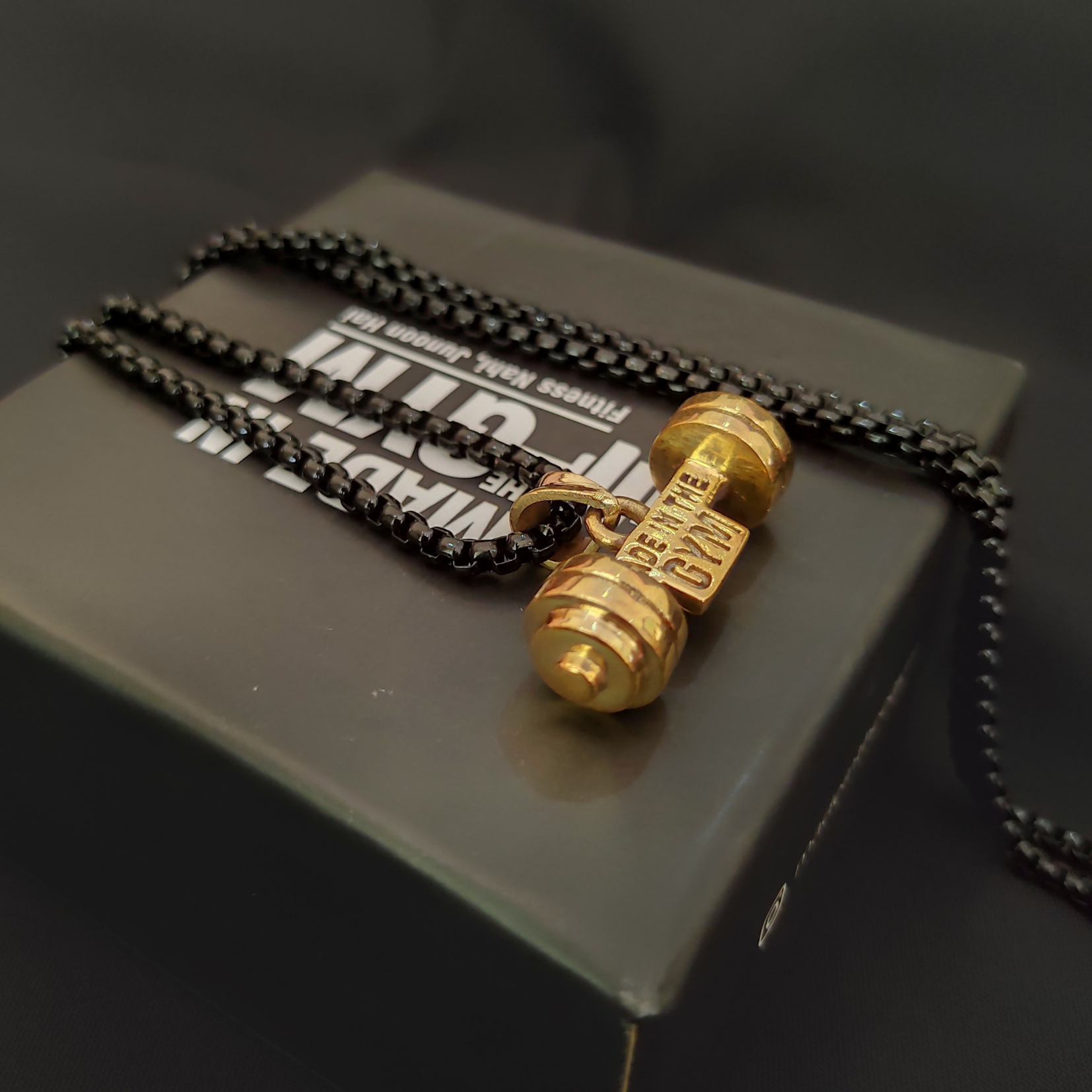Made in the GYM pendant with branded packaging and card – premium unboxing experience for fitness lovers.