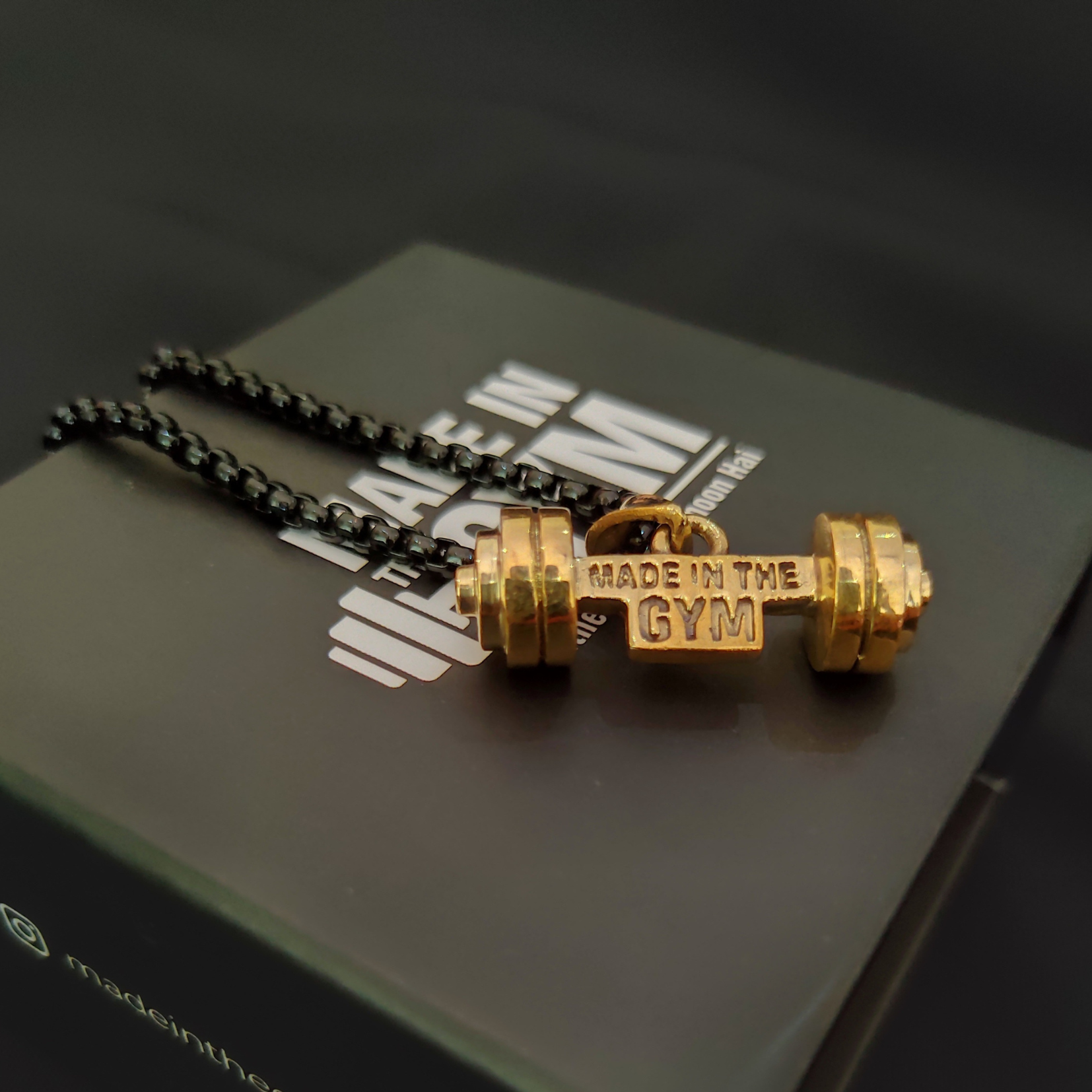 Made in the GYM pendant with branded packaging and card – premium unboxing experience for fitness lovers.