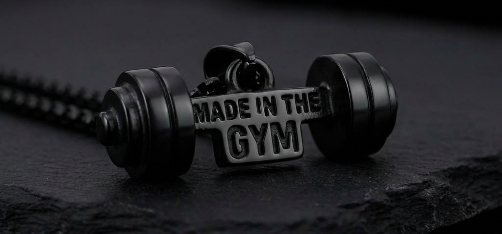 Black Dumbbell with 'Made in the Gym' text on a dark background