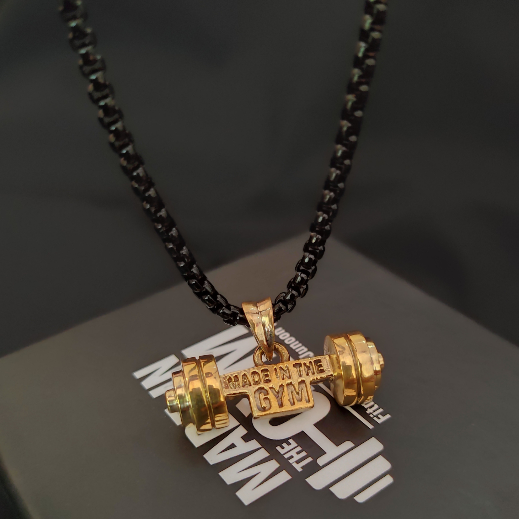 Made in the GYM pendant with branded packaging and card – premium unboxing experience for fitness lovers.