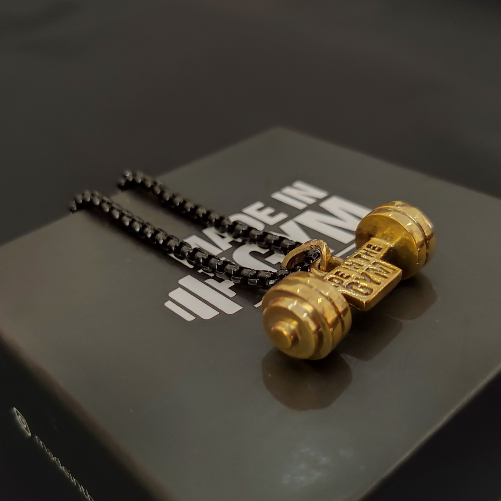 Made in the GYM pendant with branded packaging and card – premium unboxing experience for fitness lovers.
